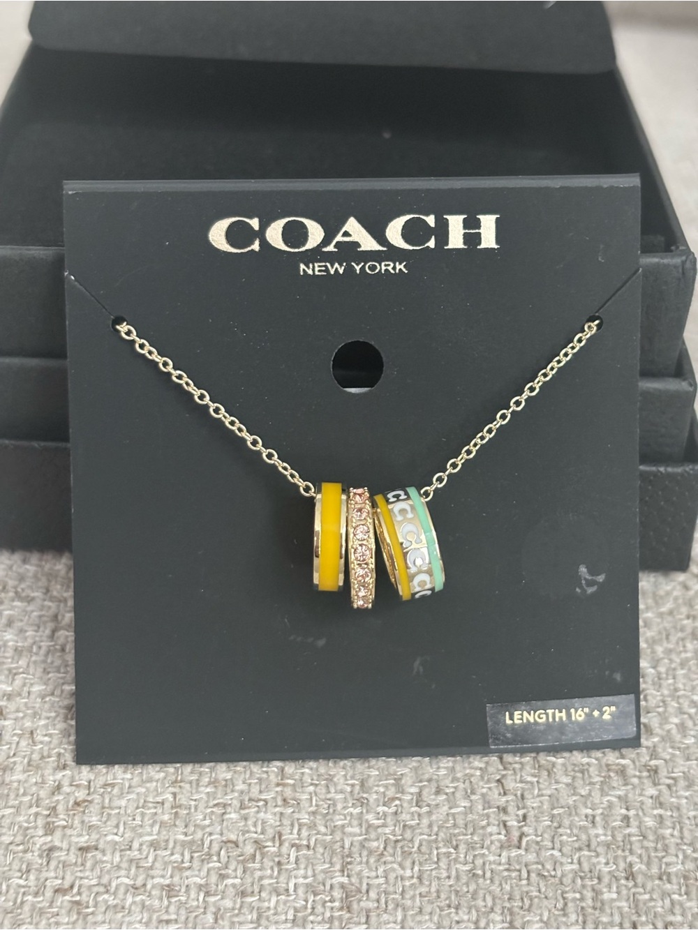 COACH Gold-Tone Necklace with Yellow and Mint Enamel Ring Charms